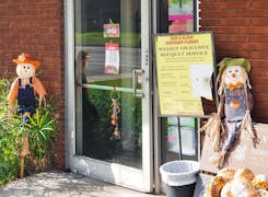 Stuffed scarecrows welcome visitors to the front door of our Whittier showroom