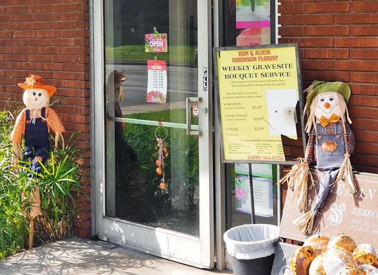 Stuffed scarecrows welcome visitors to the front door of our Whittier showroom