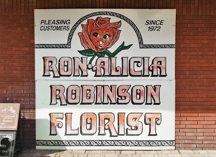 Our hand-painted sign still hangs on the wall of our Rowland Heights location